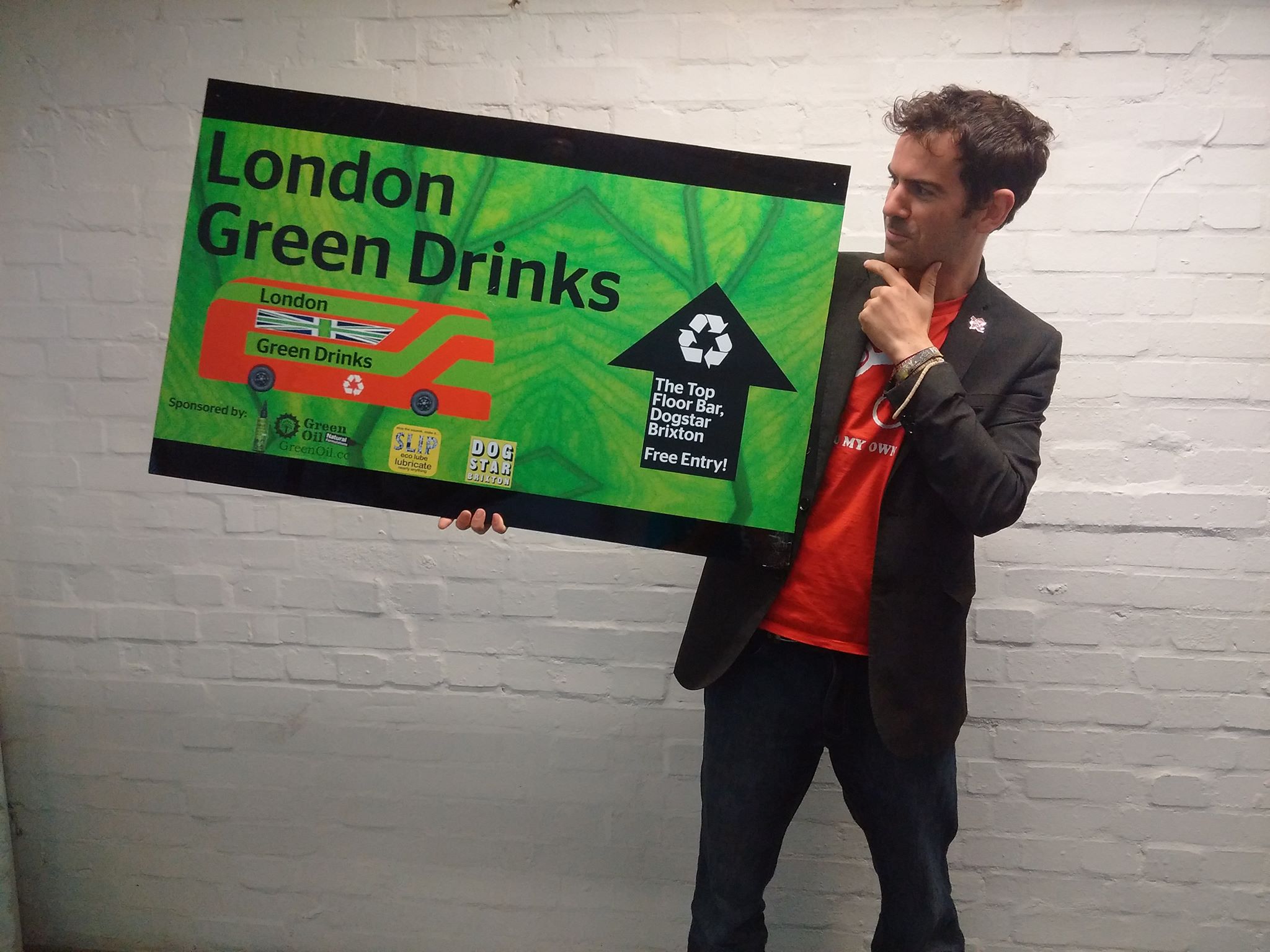 Simon Nash holding a the London Green Drinks sign